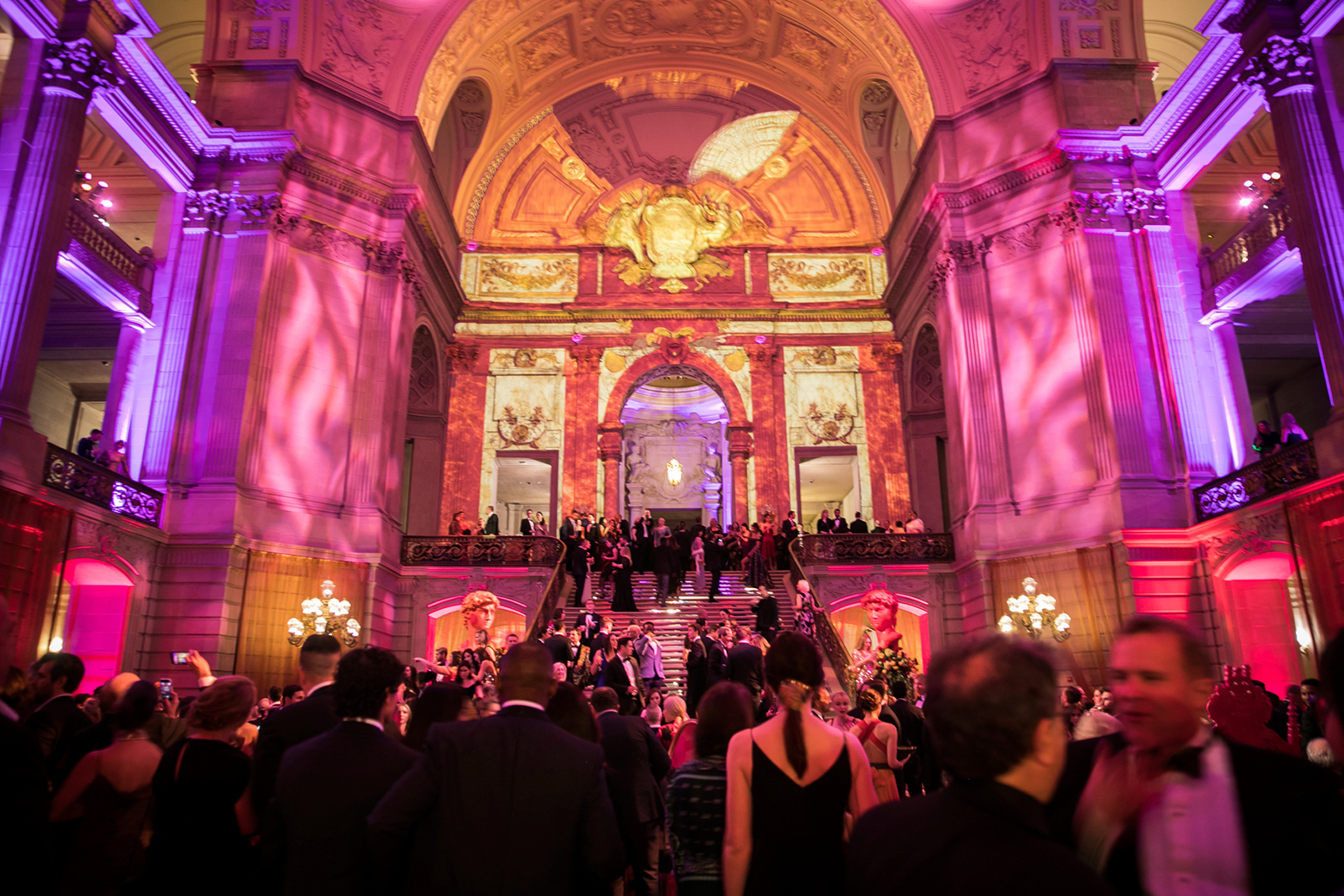 Black-tie dinner hall with chandeliers